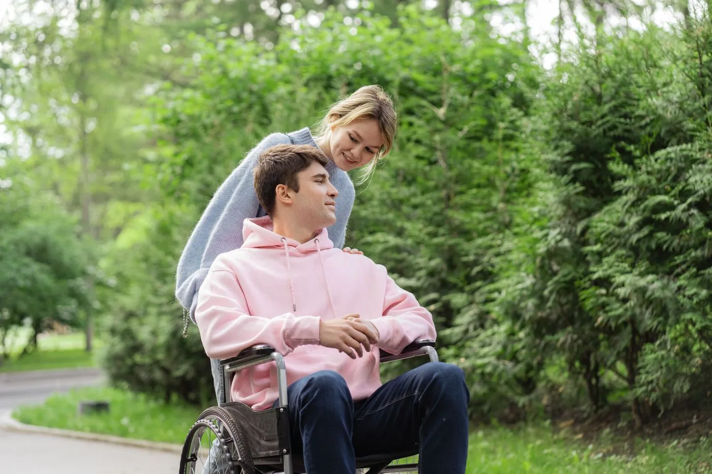 Two people walking and talking outdoors